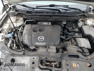 2014 Mazda CX-5 Touring z VIN JM3KE4CY1E0406726, wystawiony jako Copart lot #54652065 z przebiegiem 245 491 mil mil oraz Szkoda całkowita • Salvage title. Historia ofert i sprzedaży dostępna na DreamBid. Obrazek 12.