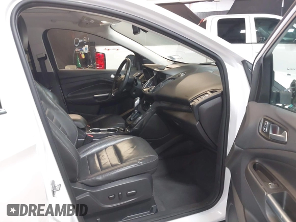 2016 Ford Escape Titanium with VIN 1FMCU9J94GUB02810, listed as a IAAI auction lot 41643907 with 119,684 mi miles. Bid and sale history available at carsss.com. Image 5.