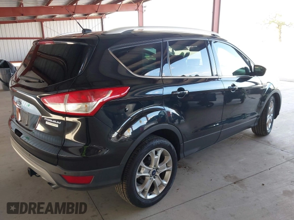 2015 Ford Escape Titanium with VIN 1FMCU0J98FUB95597, listed as a IAAI auction lot 41785188 with 84,141 mi miles. Bid and sale history available at carsss.com. Image 4.