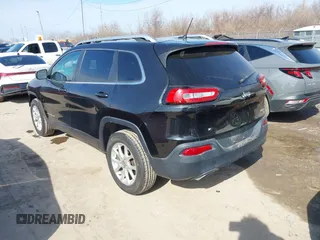 2015 Jeep Cherokee North with VIN 1C4PJMCS4FW792918, listed as a IAAI auction lot 41748651 with 107,034 mi miles. Bid and sale history available at carsss.com. Image 3.