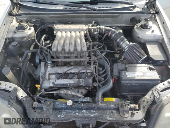 2003 Hyundai Tiburon GT z VIN KMHHN65F13U102985, wystawiony jako Copart lot #45294325 z przebiegiem 326 919 mil mil oraz Szkoda całkowita • Salvage title. Historia ofert i sprzedaży dostępna na DreamBid. Obrazek 11.