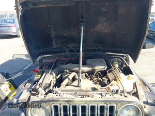 1997 Jeep Wrangler SE with VIN 1J4FY29P6VP438125, listed as a IAAI auction lot 41770455 with 163,001 mi miles. Bid and sale history available at carsss.com. Image 10.