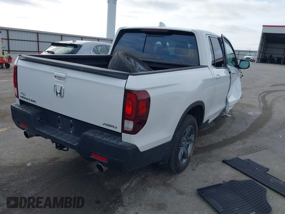 2023 Honda Ridgeline RTL with VIN 5FPYK3F55PB018188, listed as a IAAI auction lot 41952319 with 73,019 mi miles and . Bid and sale history available at DreamBid. Image 4.