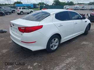 2015 Kia Optima LX with VIN KNAGM4A74F5653459, listed as a IAAI auction lot 42443188 with 109,129 mi miles and . Bid and sale history available at DreamBid. Image 4.