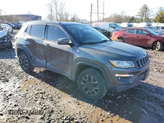 2019 Jeep Compass Trailhawk with VIN 3C4NJDDB5KT775860, listed as a Copart auction lot 48113695 with 76,091 mi miles and Salvage Title. Bid and sale history available at DreamBid. Image 4.