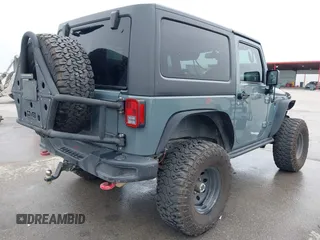 2013 Jeep Wrangler Rubicon 10th Anniversary with VIN 1C4BJWCG2DL651815, listed as a IAAI auction lot 41643919 with 98,297 mi miles and . Bid and sale history available at DreamBid. Image 4.