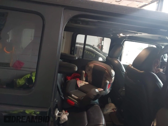 2021 Jeep Wrangler Unlimited Rubicon with VIN 1C4HJXFN2MW587168, listed as a IAAI auction lot 42472309 with 66,272 mi miles and . Bid and sale history available at DreamBid. Image 8.