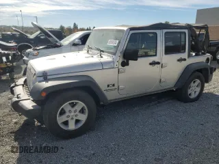 2007 Jeep Wrangler Unlimited X with VIN 1J8GB39157L142982, listed as a Copart auction lot 82050134 with 72,666 mi miles and Salvage Title. Bid and sale history available at DreamBid. Image 1.