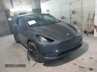 2023 Tesla Model Y Long Range z VIN 7SAYGDEE3PA034830, wystawiony jako IAAI lot #41351397 z przebiegiem 26 704 mil mil oraz . Historia ofert i sprzedaży dostępna na DreamBid. Obrazek 1.