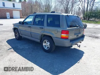 1997 Jeep Grand Cherokee Laredo with VIN 1J4GZ58S7VC713517, listed as a IAAI auction lot 42062214 with 205,533 mi miles. Bid and sale history available at carsss.com. Image 3.