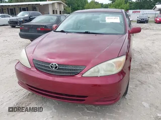 2002 Toyota Camry LE z VIN 4T1BE30K32U110304, wystawiony jako IAAI lot #42357455 z przebiegiem 221 389 mil mil oraz . Historia ofert i sprzedaży dostępna na DreamBid. Obrazek 6.