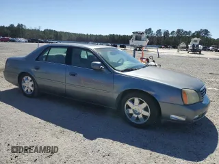 2003 Cadillac DeVille DTS z VIN 1G6KF579X3U233215, wystawiony jako Copart lot #48636775 z przebiegiem 99 144 mil mil oraz Nie do naprawy. Historia ofert i sprzedaży dostępna na DreamBid. Obrazek 4.