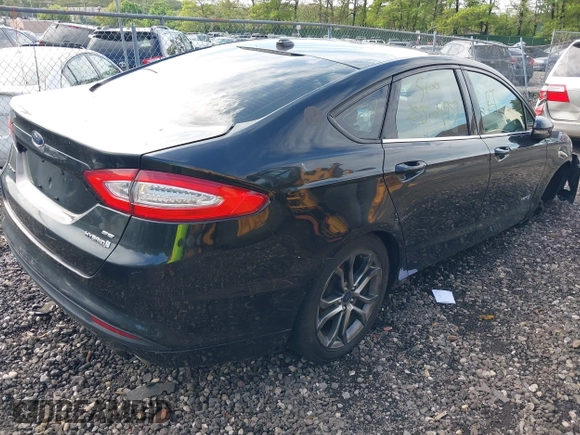 2015 Ford Fusion SE Hybrid with VIN 3FA6P0LU0FR229409, listed as a IAAI auction lot 42272404 with Not provided miles and . Bid and sale history available at DreamBid. Image 4.