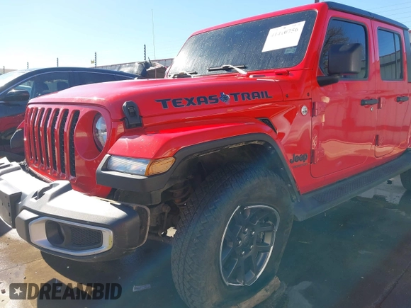 2021 Jeep Gladiator Freedom z VIN 1C6HJTAG7ML609661, wystawiony jako IAAI lot #41410756 z przebiegiem 44 636 mil mil oraz . Historia ofert i sprzedaży dostępna na DreamBid. Obrazek 6.