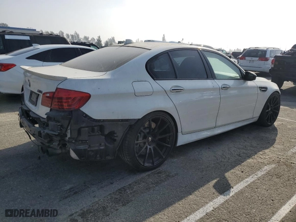 2014 BMW M5 with VIN WBSFV9C56ED097642, listed as a Copart auction lot 87054484 with 77,022 mi miles and Salvage Title. Bid and sale history available at carsss.com. Image 3.