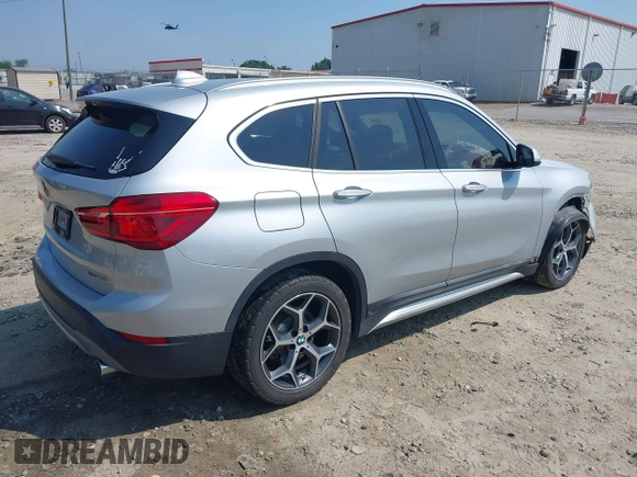 2018 BMW X1 xDrive28i with VIN WBXHT3C39J5L27926, listed as a IAAI auction lot 42582330 with 101,197 mi miles and . Bid and sale history available at DreamBid. Image 4.