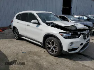 2019 BMW X1 xDrive28i with VIN WBXHT3C59K5L90317, listed as a Copart auction lot 61028125 with 46,789 mi miles and Salvage title. Bid and sale history available at DreamBid. Image 4.