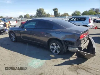 2014 Dodge Charger SE with VIN 2C3CDXBG3EH241269, listed as a Copart auction lot 72626134 with 217,372 mi miles and Salvage Title. Bid and sale history available at carsss.com. Image 2.