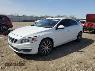 2014 Volvo S60 T5 with VIN YV1612FS0E1295074, listed as a Copart auction lot 51162405 with 128,540 mi miles and Salvage Title. Bid and sale history available at carsss.com. Image 1.