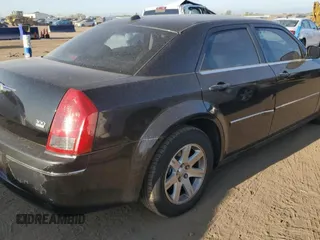 2006 Chrysler 300 Touring with VIN 2C3LA53G06H125654, listed as a Copart auction lot 71224414 with 145,759 mi miles and Salvage Title. Bid and sale history available at carsss.com. Image 3.