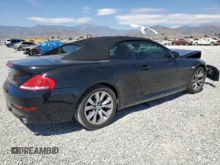 2009 BMW 6 Series 650i with VIN WBAEB53569C224337, listed as a Copart auction lot 68148974 with 75,057 mi miles and Salvage Title. Bid and sale history available at carsss.com. Image 3.
