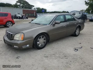 2000 Cadillac DeVille DTS with VIN 1G6KF5794YU249059, listed as a Copart auction lot 71614494 with 121,611 mi miles and Salvage Title. Bid and sale history available at carsss.com. Image 1.
