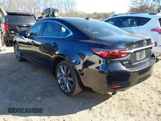 2018 Mazda 6 Grand Touring with VIN JM1GL1TY0J1319083, listed as a IAAI auction lot 40852818 with 57,408 mi miles and . Bid and sale history available at DreamBid. Image 3.