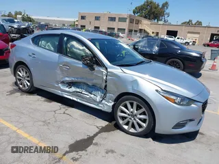 2017 Mazda 3 Touring with VIN 3MZBN1V76HM119389, listed as a IAAI auction lot 42772015 with 128,555 mi miles and . Bid and sale history available at DreamBid. Image 1.