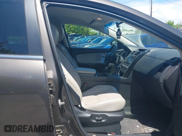 2015 Mazda CX-9 Touring z VIN JM3TB2CV1F0458995, wystawiony jako IAAI lot #42523344 z przebiegiem 130 763 mil mil oraz . Historia ofert i sprzedaży dostępna na DreamBid. Obrazek 5.