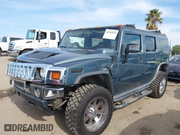 2005 Hummer H2 SUV with VIN 5GRGN23U35H105620, listed as a IAAI auction lot 41912574 with 232,938 mi miles. Bid and sale history available at carsss.com. Image 18.