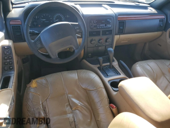 1999 Jeep Grand Cherokee Laredo z VIN 1J4GW58NXXC704719, wystawiony jako Copart lot #49546395 z przebiegiem 276 716 mil mil oraz Czysty tytuł • Clean title. Historia ofert i sprzedaży dostępna na DreamBid. Obrazek 8.