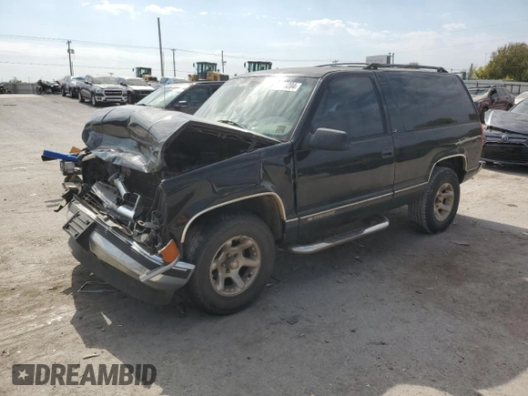 1999 Chevrolet Tahoe z VIN 3GNEC18R3XG165012, wystawiony jako Copart lot #75803204 z przebiegiem 227 608 mil mil oraz Szkoda całkowita • Salvage title. Historia ofert i sprzedaży dostępna na DreamBid. Obrazek 1.