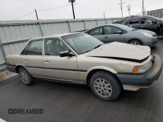 1991 Toyota Camry z VIN 4T1SV24E0MU379572, wystawiony jako Copart lot #78090294 z przebiegiem 242 052 mil mil oraz Szkoda całkowita • Salvage title. Historia ofert i sprzedaży dostępna na DreamBid. Obrazek 4.