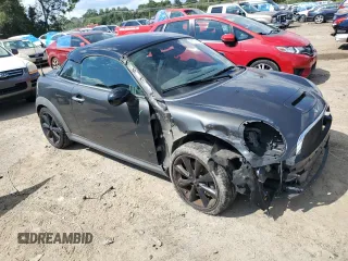 2015 MINI Coupe S z VIN WMWSX3C55FT409449, wystawiony jako Copart lot #66574174 z przebiegiem 99 155 mil mil oraz Szkody całkowita. Historia ofert i sprzedaży dostępna na DreamBid. Obrazek 4.