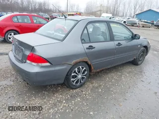 2006 Mitsubishi Lancer ES with VIN JA3AJ26E76U066867, listed as a IAAI auction lot 41904428 with 247,460 mi miles. Bid and sale history available at carsss.com. Image 4.