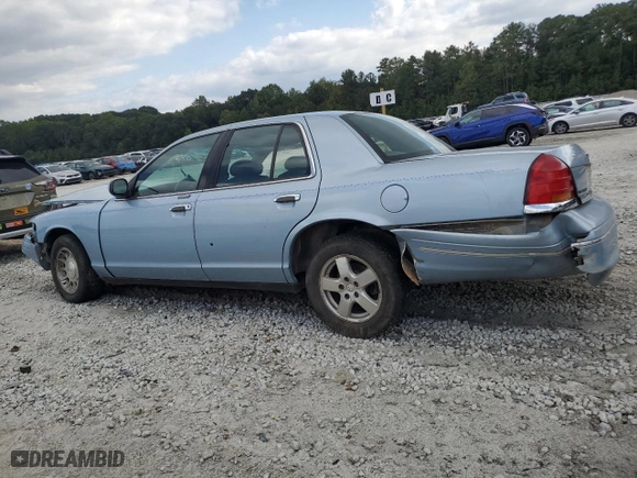 1999 Ford Crown Victoria LX with VIN 2FAFP74WXXX137154, listed as a Copart auction lot 71418784 with 97,589 mi miles and Salvage Title. Bid and sale history available at carsss.com. Image 2.