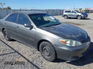 2002 Toyota Camry LE z VIN JTDBE32K920106928, wystawiony jako IAAI lot #41973362 z przebiegiem 289 924 mil mil oraz . Historia ofert i sprzedaży dostępna na DreamBid. Obrazek 1.