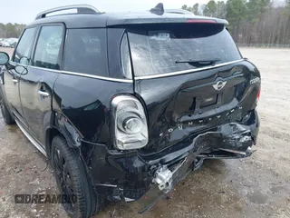 2017 MINI Countryman Cooper S with VIN WMZYT3C34H3D98585, listed as a IAAI auction lot 41752740 with 58,381 mi miles. Bid and sale history available at carsss.com. Image 6.