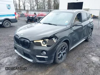2018 BMW X1 xDrive28i with VIN WBXHT3C34J5K31430, listed as a IAAI auction lot 41954792 with 125,447 mi miles. Bid and sale history available at carsss.com. Image 6.