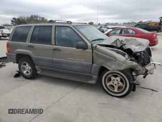 1998 Jeep Grand Cherokee Laredo with VIN 1J4FX58S0WC337066, listed as a Copart auction lot 69125414 with 0 mi miles and Salvage Title. Bid and sale history available at carsss.com. Image 4.