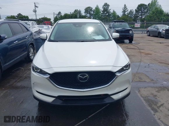 2018 Mazda CX-5 Touring with VIN JM3KFBCMXJ0366008, listed as a IAAI auction lot 42079989 with 153,868 mi miles and . Bid and sale history available at DreamBid. Image 12.