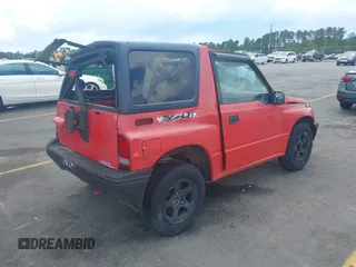 1995 Chevrolet Tracker z VIN 2CNBJ1869S6902771, wystawiony jako IAAI lot #41997456 z przebiegiem 171 629 mil mil oraz . Historia ofert i sprzedaży dostępna na DreamBid. Obrazek 4.