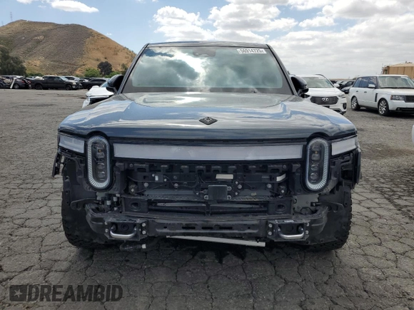 2022 Rivian R1S Launch Edition z VIN 7PDSGABL5NN001018, wystawiony jako Copart lot #56914725 z przebiegiem 26 156 mil mil oraz Szkoda całkowita • Salvage title. Historia ofert i sprzedaży dostępna na DreamBid. Obrazek 5.