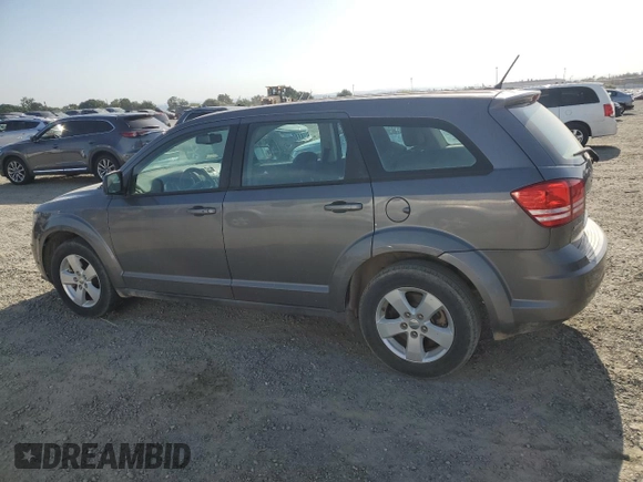 2013 Dodge Journey American Value with VIN 3C4PDCAB8DT590509, listed as a Copart auction lot 57347375 with 203,642 mi miles and Clean title. Bid and sale history available at DreamBid. Image 2.
