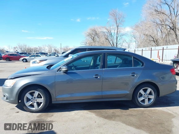 2012 Volkswagen Jetta TDI w/Premium & Nav z VIN 3VWLL7AJ5CM361646, wystawiony jako IAAI lot #41856672 z przebiegiem 190 292 mil mil oraz . Historia ofert i sprzedaży dostępna na DreamBid. Obrazek 14.