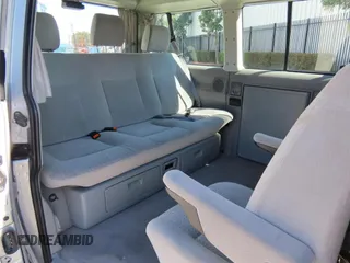 2003 Volkswagen EuroVan MV с VIN WV2NB47003H003033, выставлен на аукционе Copart как лот 59629785 с пробегом 164 173 миль миль и Чистый • Clean title. История ставок и продаж доступна на DreamBid. Изображение 6.