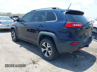 2015 Jeep Cherokee Trailhawk with VIN 1C4PJMBS3FW704622, listed as a IAAI auction lot 42465702 with 96,831 mi miles and . Bid and sale history available at DreamBid. Image 3.