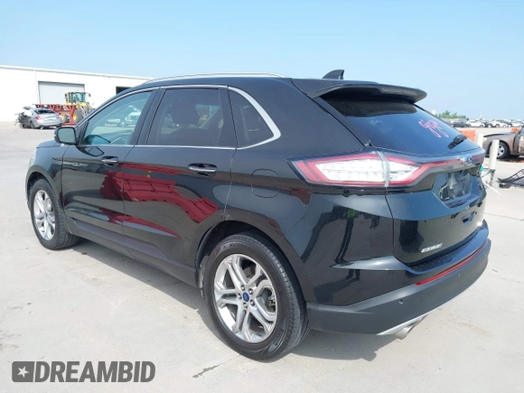 2015 Ford Edge Titanium z VIN 2FMTK3K87FBC06852, wystawiony jako IAAI lot #42335238 z przebiegiem 187 256 mil mil oraz . Historia ofert i sprzedaży dostępna na DreamBid. Obrazek 3.