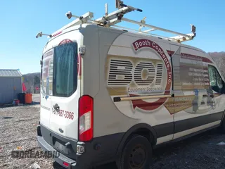 2016 Ford Transit Cargo z VIN 1FTYR2CG4GKA82911, wystawiony jako IAAI lot #41909433 z przebiegiem Nie podano mil oraz . Historia ofert i sprzedaży dostępna na DreamBid. Obrazek 22.