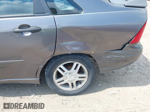 2004 Ford Focus SE with VIN 1FAFP34334W177338, listed as a IAAI auction lot 42003202 with 190,581 mi miles and . Bid and sale history available at DreamBid. Image 6.